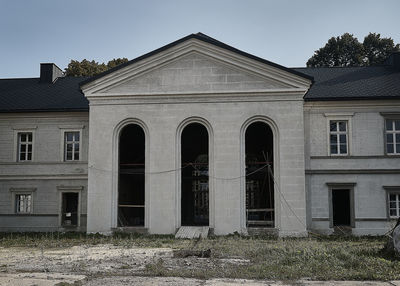 Exterior of abandoned building against sky