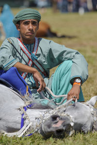 Portrait of a man sitting outdoors