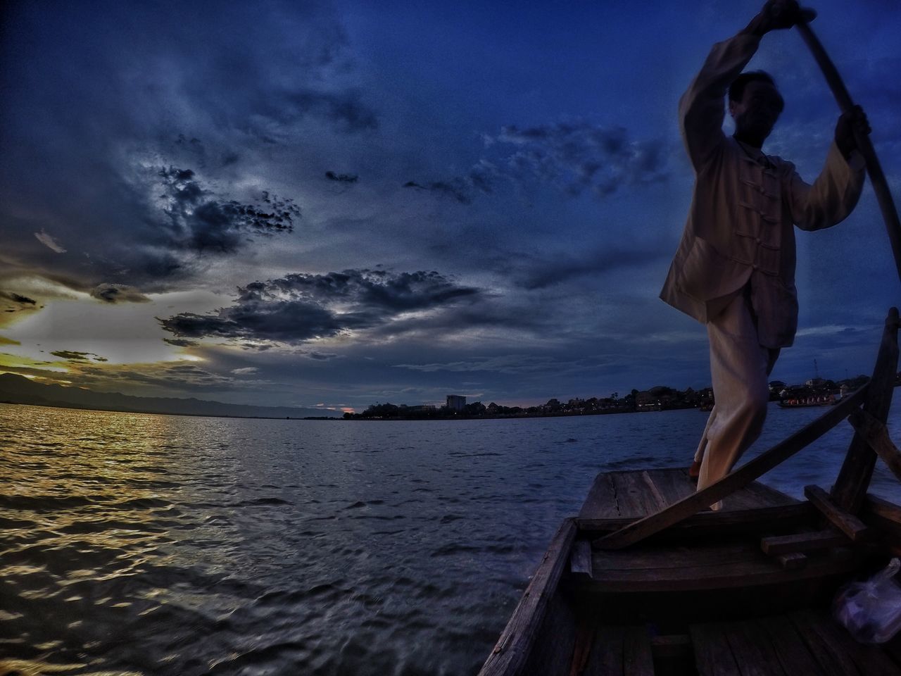 sky, water, cloud - sky, sea, cloud, blue, standing, leisure activity, lifestyles, men, rear view, outdoors, nature, built structure, full length, pier, scenics, cloudy