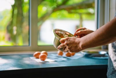 Person preparing omelet