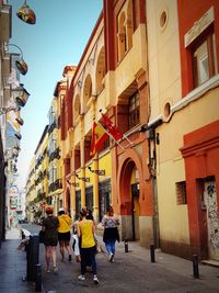 People walking on street in city