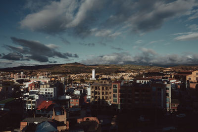 High angle view of buildings in city against sky