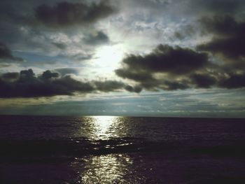 Scenic view of sea against cloudy sky