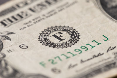 Close-up of bitcoin on paper currency
