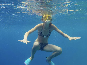 Girl swimming in sea