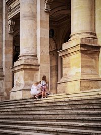 People in front of historic building