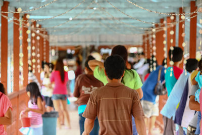 Rear view of people at amusement park