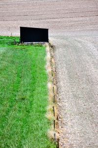High angle view of footpath in field