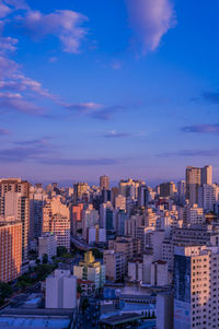 High angle view of buildings in city against sky