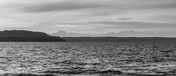 A view of the puget sound and mountains covered with haze.