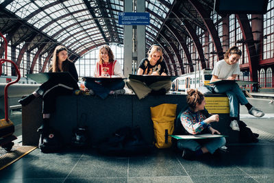 Group of people sitting at home