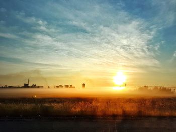 Scenic view of landscape against sky during sunset