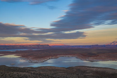 Scenic view of lake against sky during sunset
