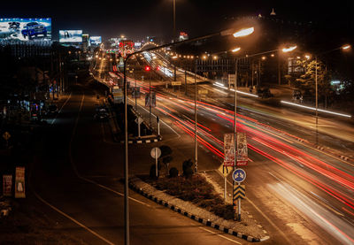 High angle view of light trails on road at night