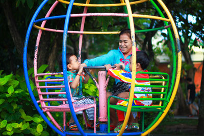 Children playing on slide at playground