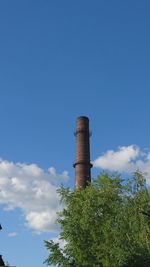 Low angle view of smoke stack against sky