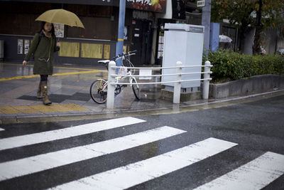 Woman on zebra crossing in city