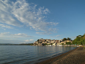 View of beach against cloudy sky