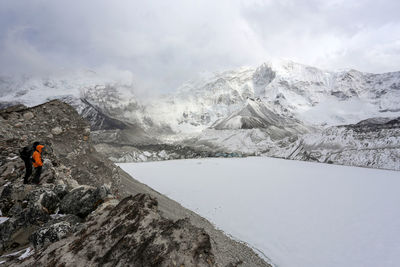 Scenic view of snow covered mountains against sky