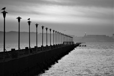 View of pier on sea against sky