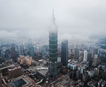 High angle view of modern buildings in city against sky