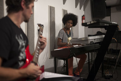 Musicians rehearsing in a recording studio