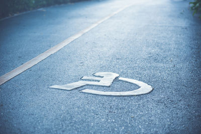 High angle view of sign on road