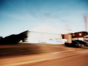 Vehicles on road along buildings