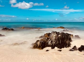 Scenic view of beach against sky