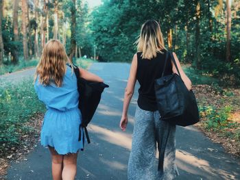 Rear view of women walking in park