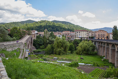 High angle view of trees and buildings against sky