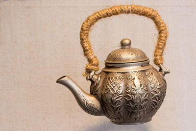 Close-up of teapot on table