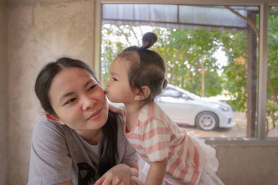 Portrait of smiling girl and woman