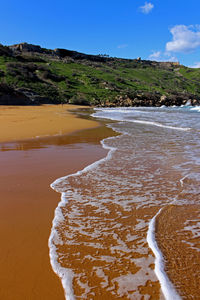 Scenic view of beach against sky