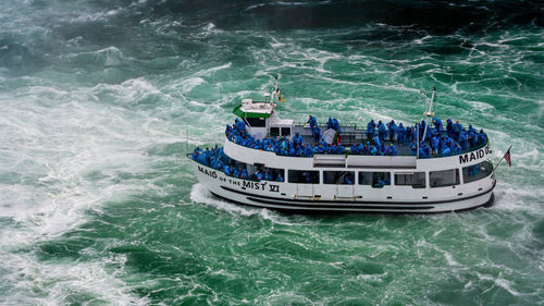 High angle view of ship sailing in sea