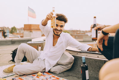 Young man sitting on table