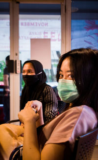 Portrait of woman looking at camera