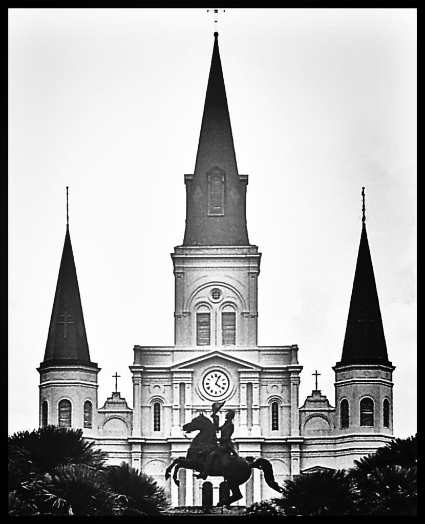 religion, place of worship, spirituality, church, cross, cathedral, building exterior, architecture, built structure, sky, low angle view, steeple, dome, outdoors, human representation, travel destinations, facade, temple - building