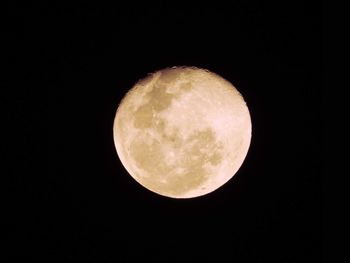 Scenic view of full moon against sky at night