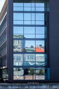 Reflection of buildings on glass window