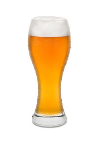 Close-up of beer glass against white background