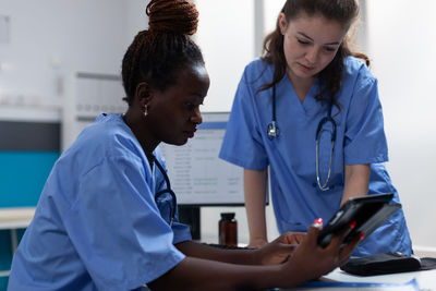 Female doctor examining patient in hospital