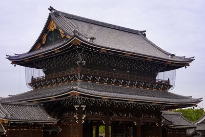 Low angle view of temple roof against sky