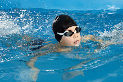 Young woman swimming in sea