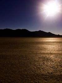 Scenic view of mountains against sky at sunset