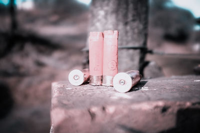 Close-up of bullets on retaining wall outdoors