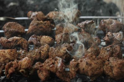 Close-up of meat on barbecue grill