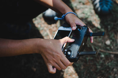 Midsection of woman photographing