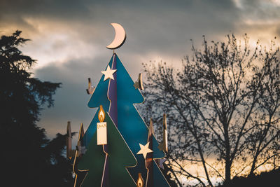 Low angle view of flag against sky during sunset