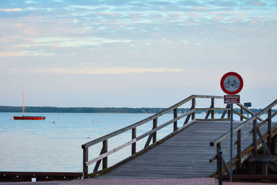 Pier over sea against sky